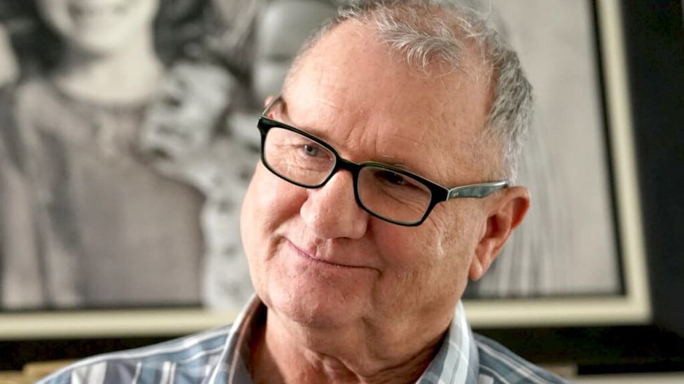 Jay on Modern Family smiling warmly