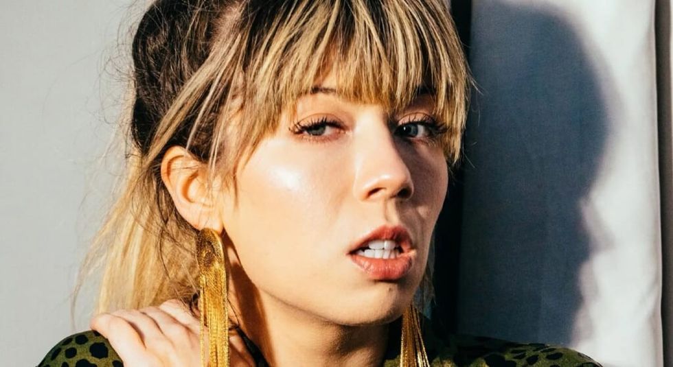 Jennette McCurdy looking straight into the camera with worried expression.