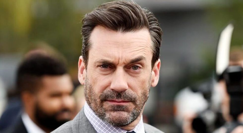 Jon Hamm raising one eyebrow looking at the camera
