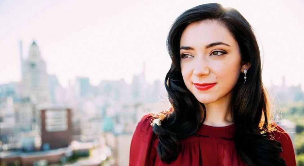 Julie Benko with red lipstick and red top.