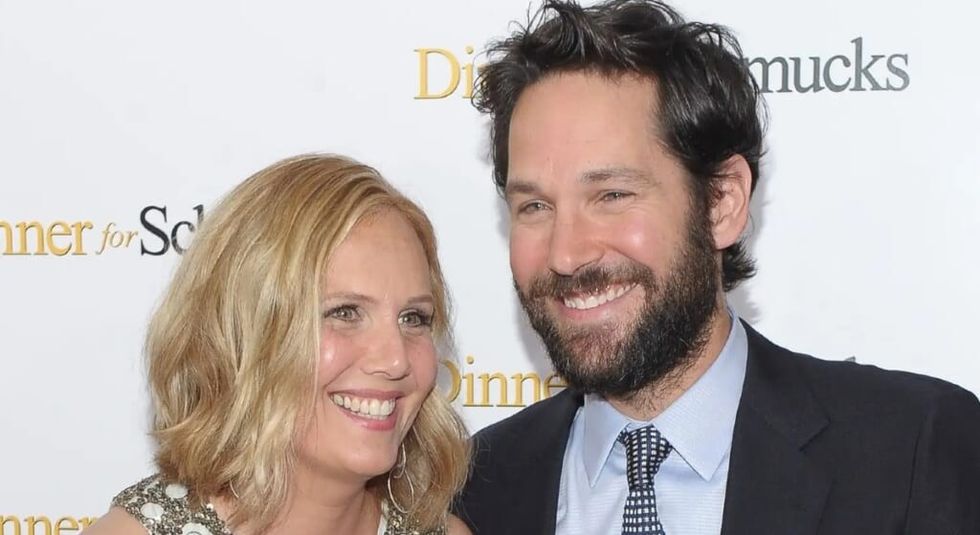 Julie Yaegar laughing with husband Paul Rudd on the red carpet.