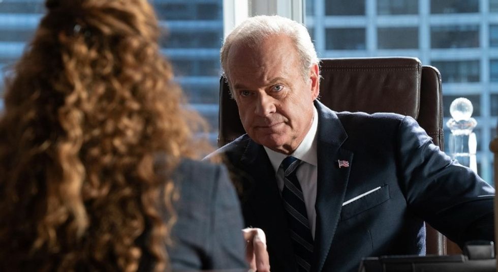 Kelsey Grammer in suit and tie during a meeting.