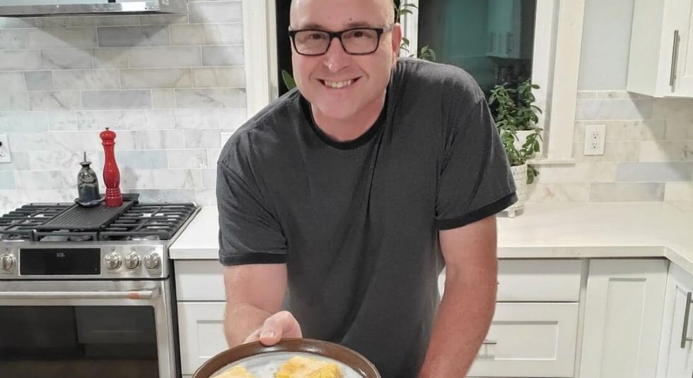 Kenney showing how to make an egg omelette.