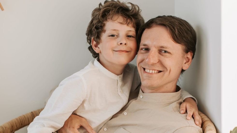 little boy hugging his dad
