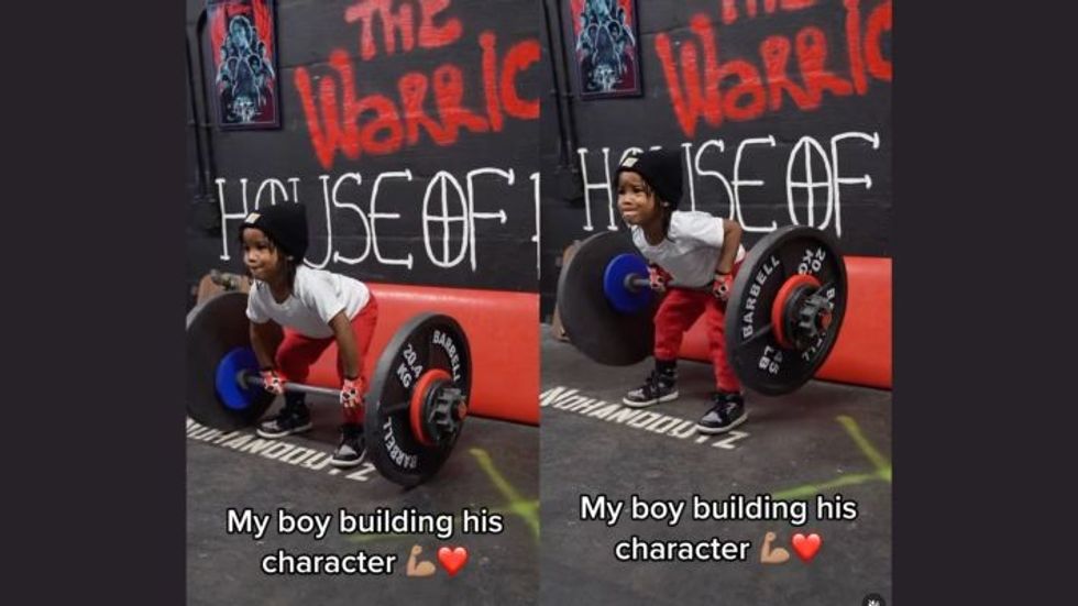 little boy lifting weights