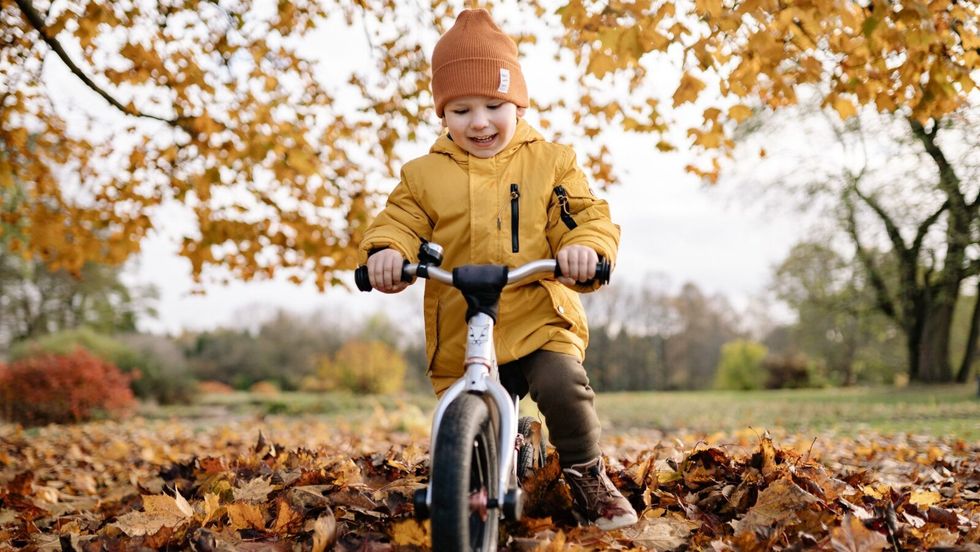 little boy riding a bike