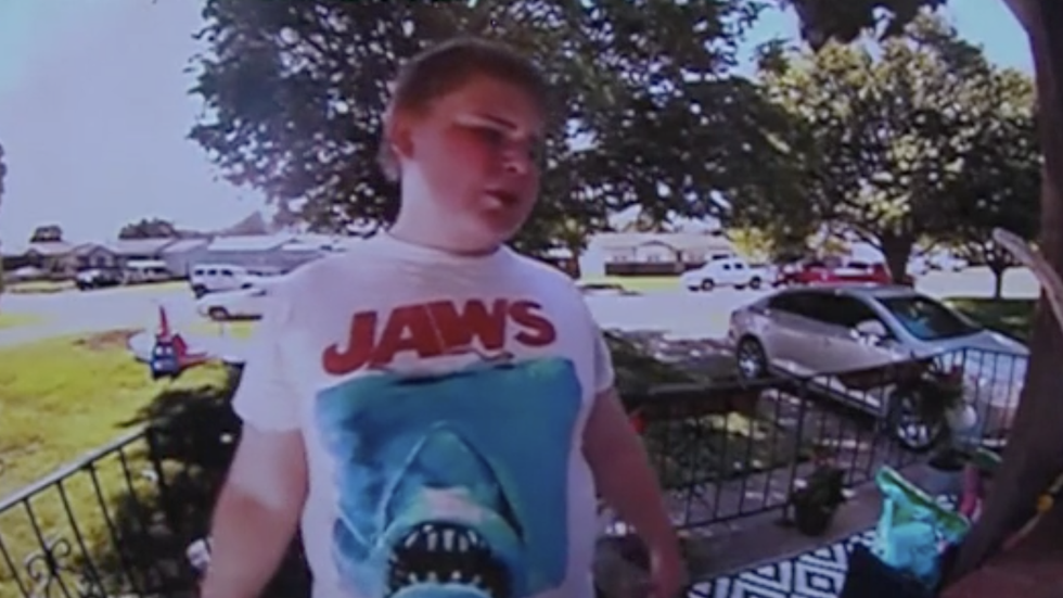 little boy ringing his neighbor's doorbell