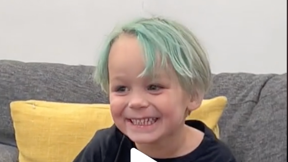 little boy with green hair