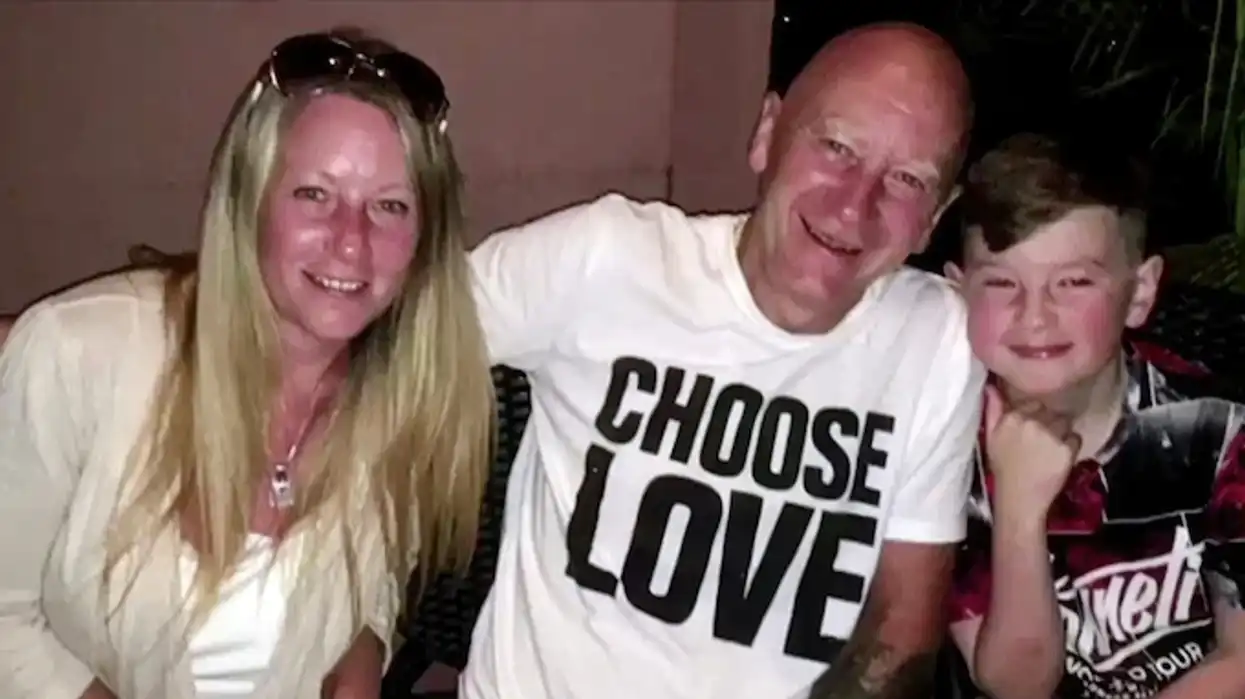 Little boy with his mother and grandfather.