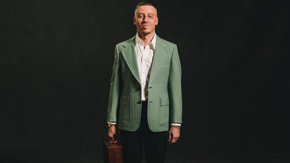Macklemore wearing green suit jacket on Next Year cover