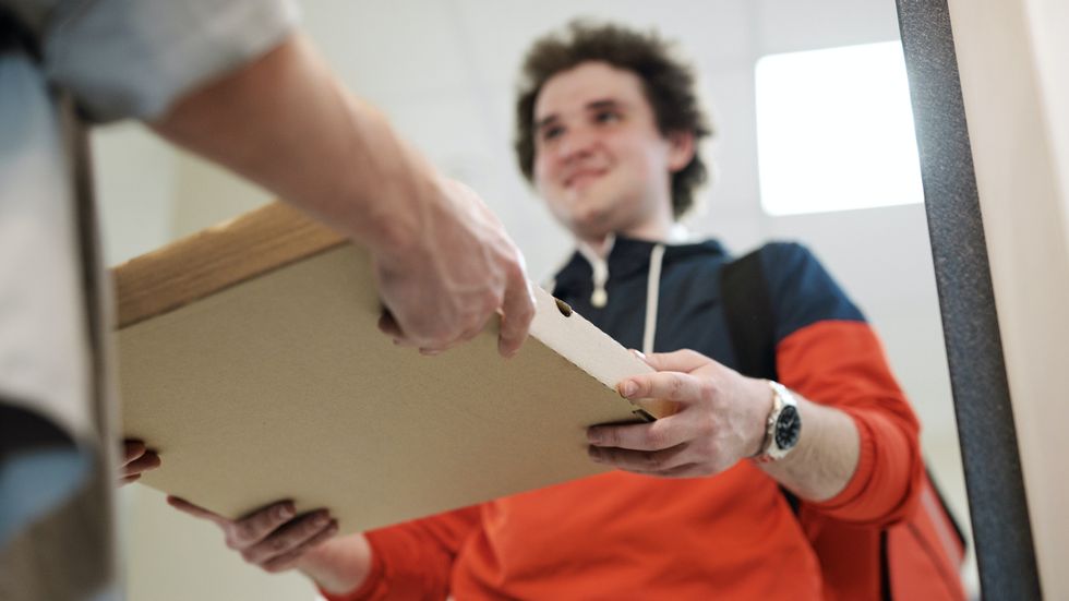 man delivering a pizza