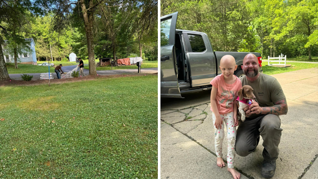 Man holding a dog stands next to a little girl.