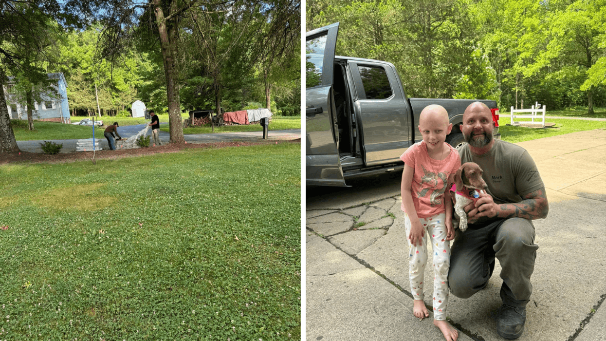 Man holding a dog stands next to a little girl.