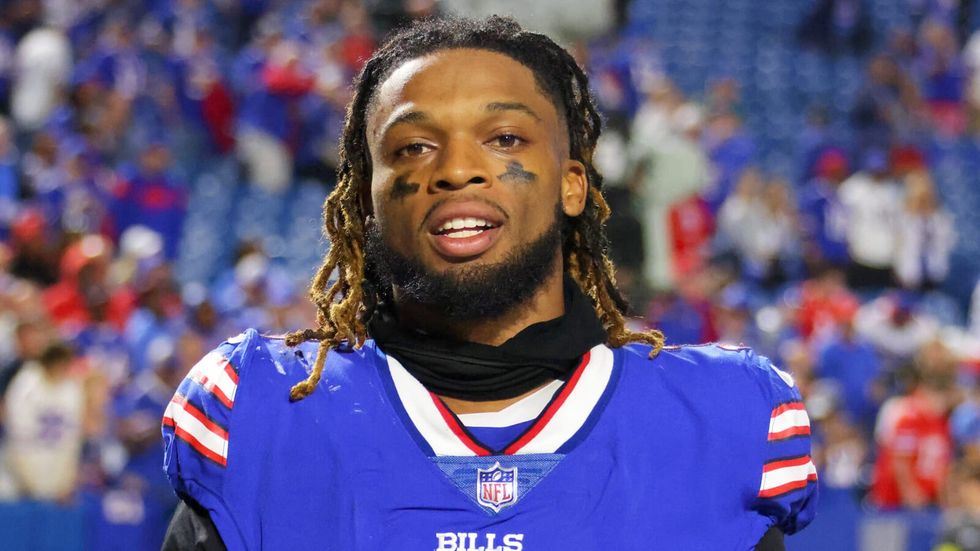 man in a blue football uniform