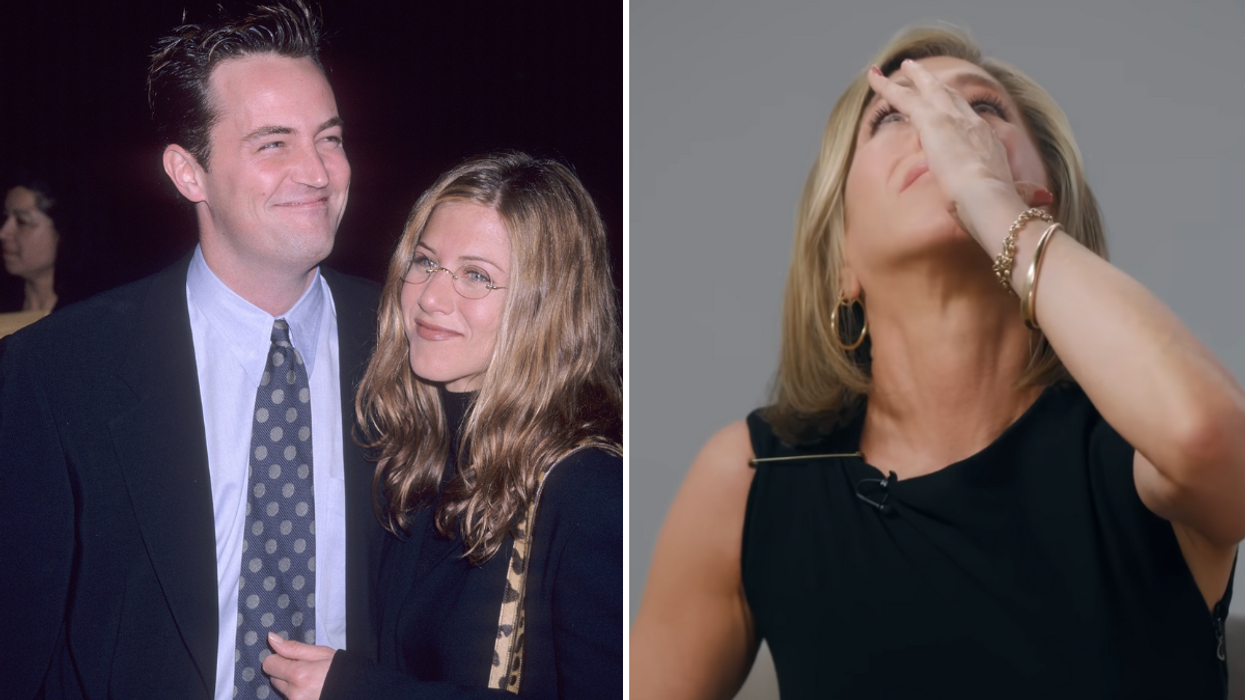 Man in a suit hugging a woman wearing glasses and a woman crying.