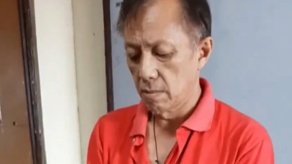 man in an orange shirt