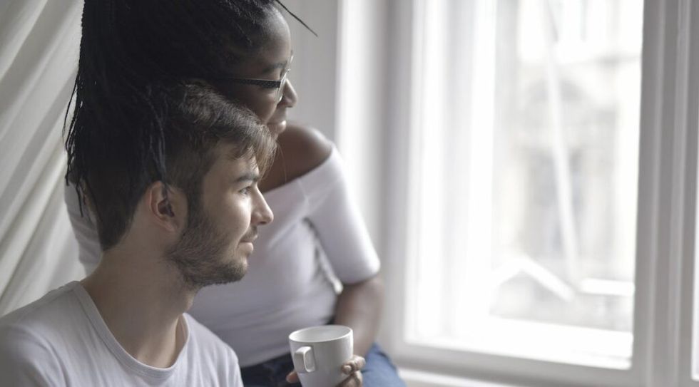 Man in white crew neck t shirt sitting next to a woman in a 3978278 1024x567