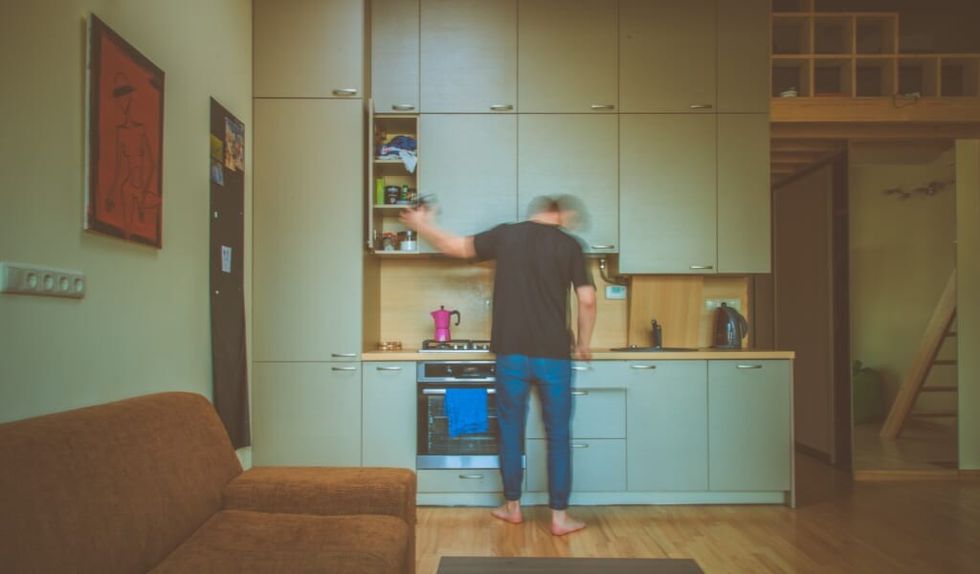 man is alone at home with his thoughts