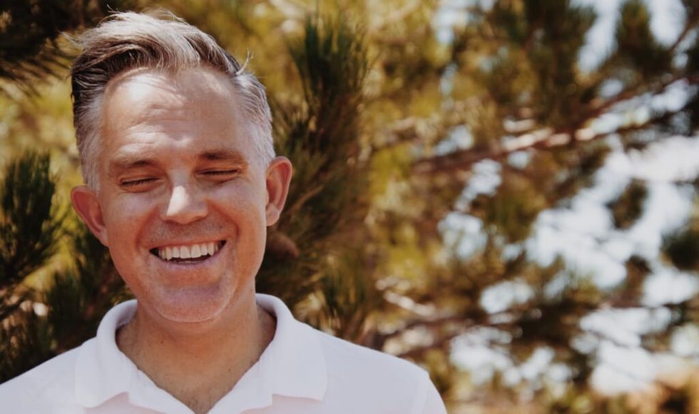 man is overcoming depression smiling outside