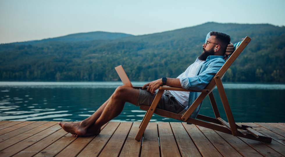 man relaxing and working