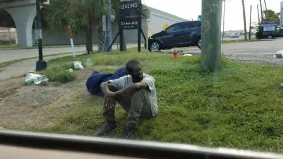man sitting on the street