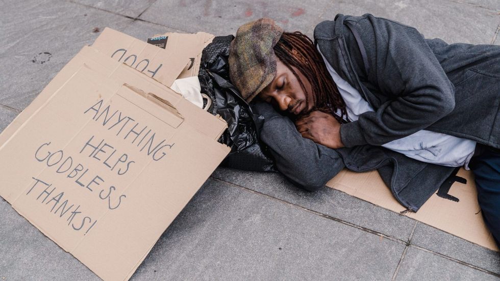 man sleeping on the ground