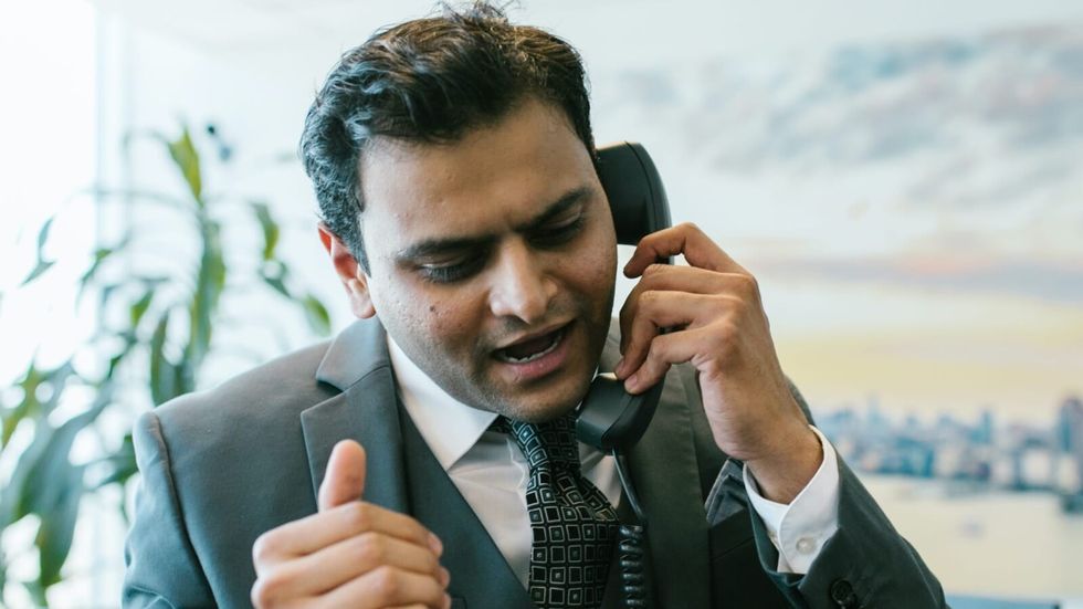 man speaking on a phone