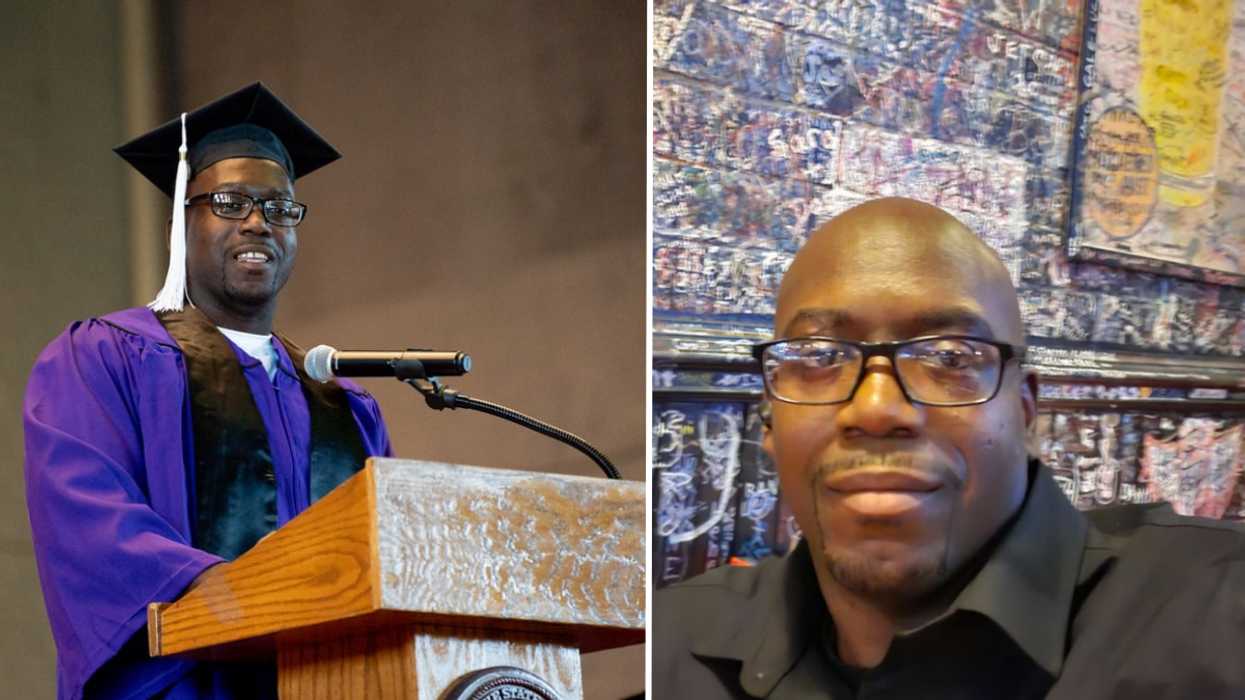 Man standing at a podium wearing a graduation cap and gown and a man wearing glasses.