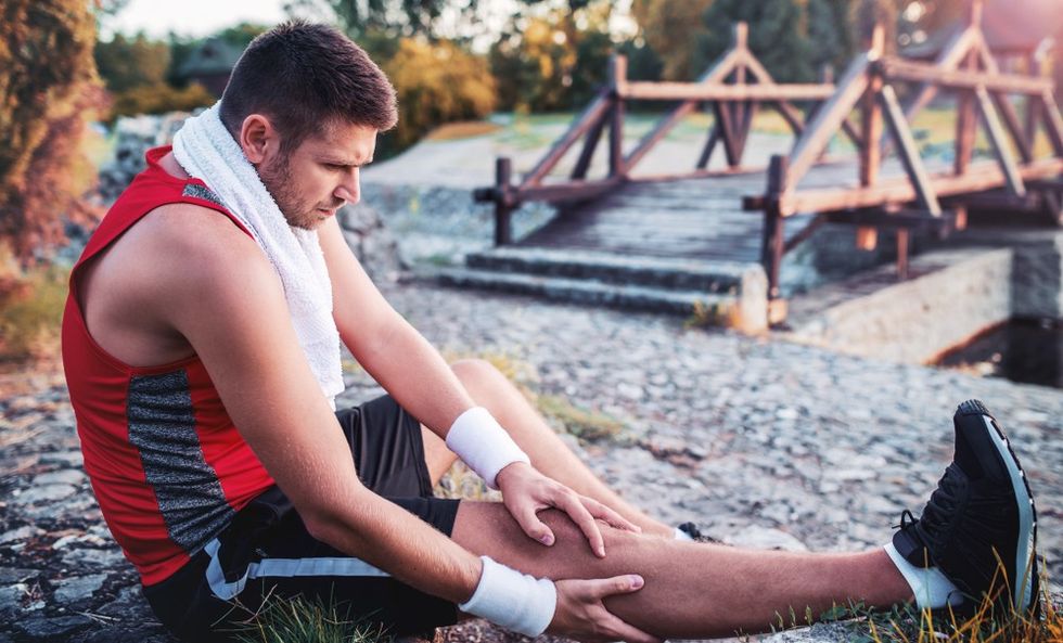 man-stretching-looking-tired