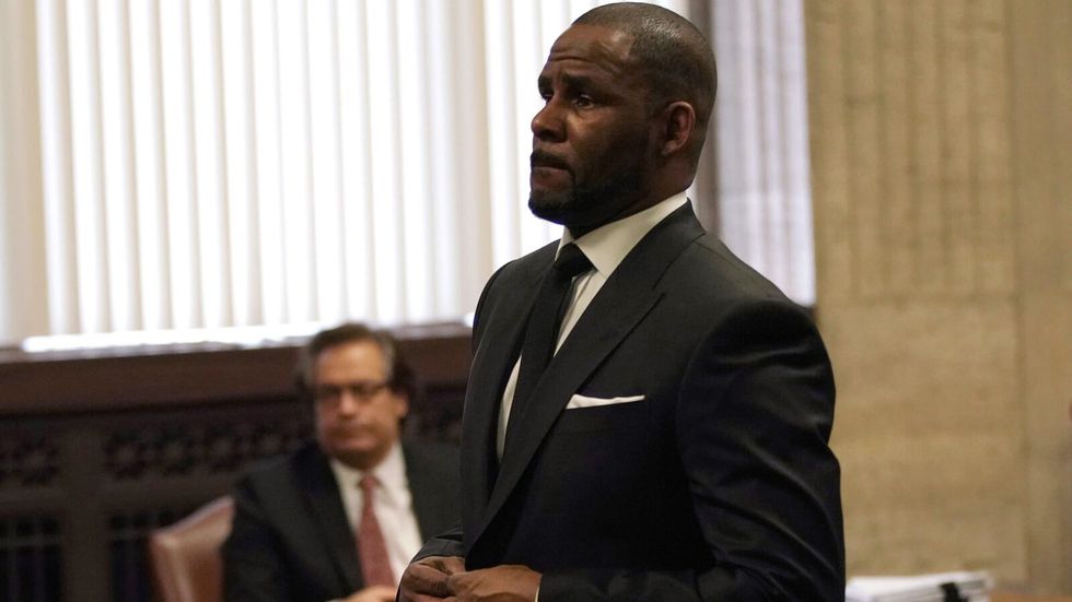 man wearing a black suit