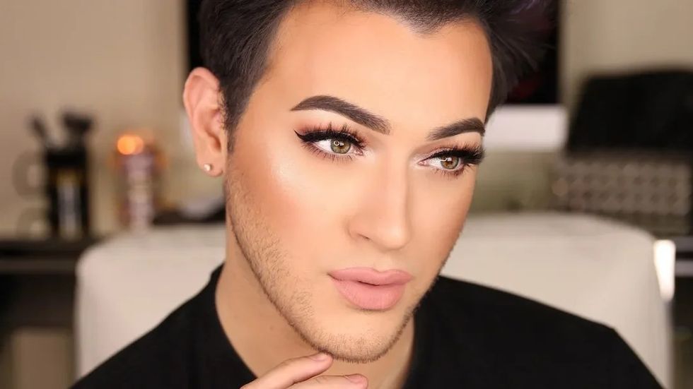 man wearing makeup posing