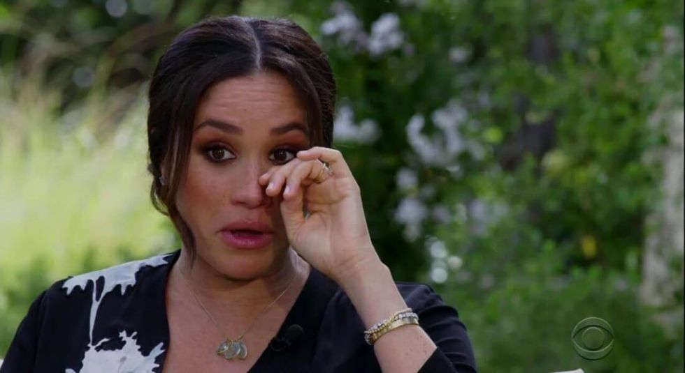 Meghan Markle wiping away a tear during her Oprah interview.