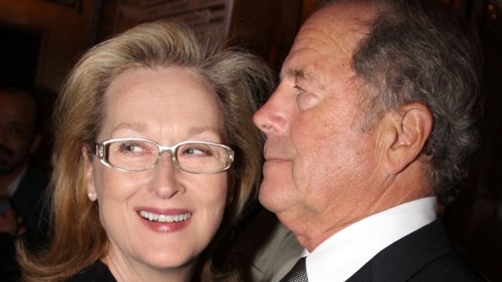 Meryl Streep and husband Don Gummer smiling and hugging.