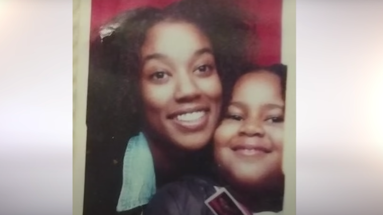 Mother and daughter pose in a photo booth