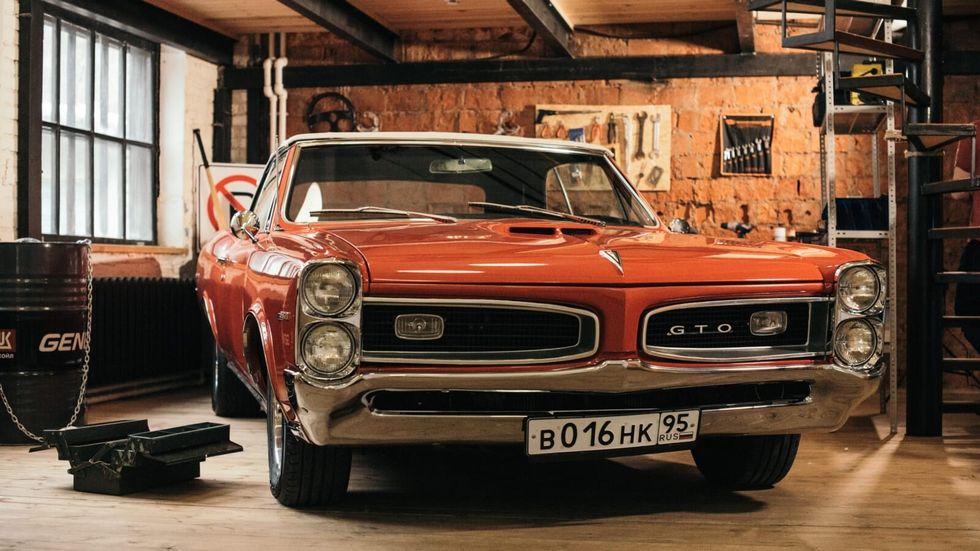 orange car in a garage