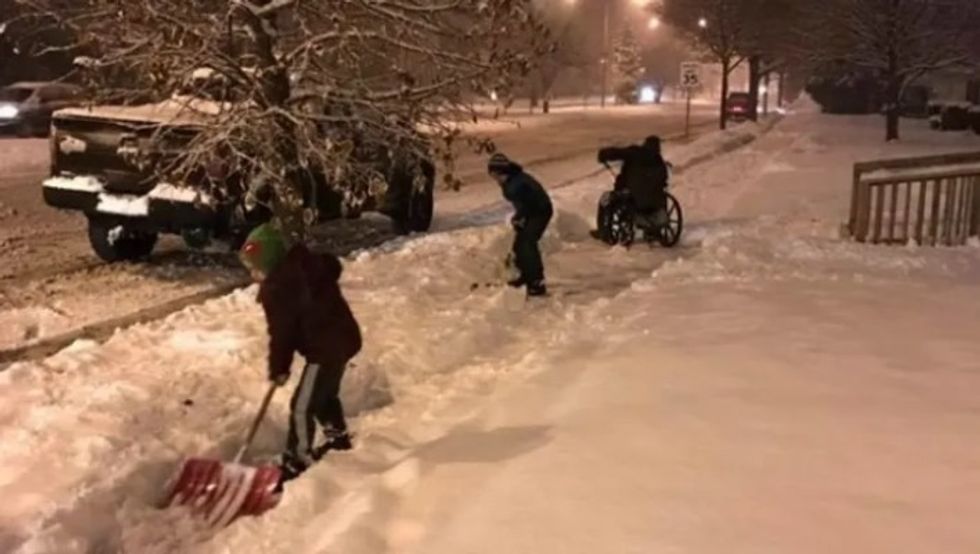 people shoveling snow