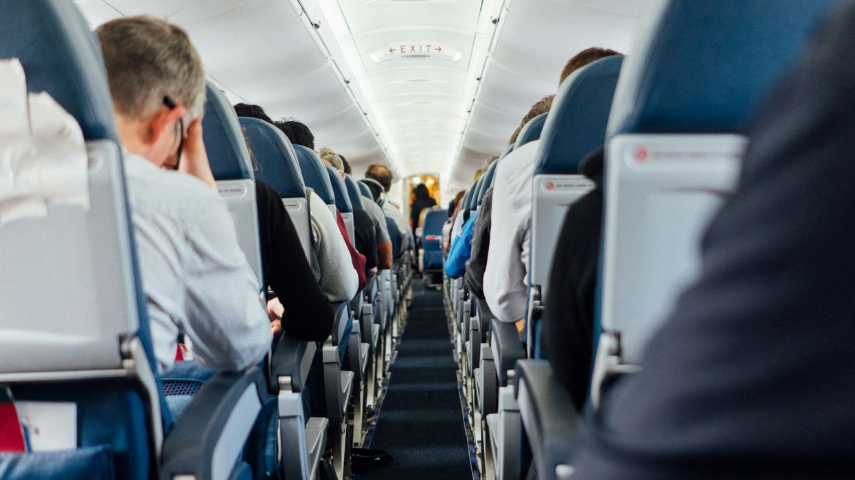 People sitting inside plane.