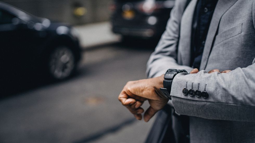 person checking their watch