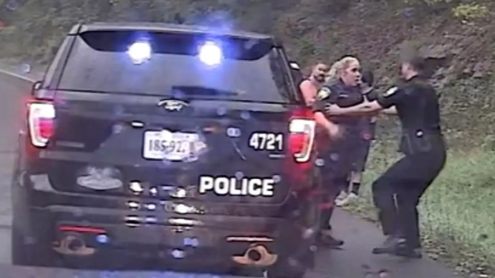 police officer saves another police officer from a colliding car