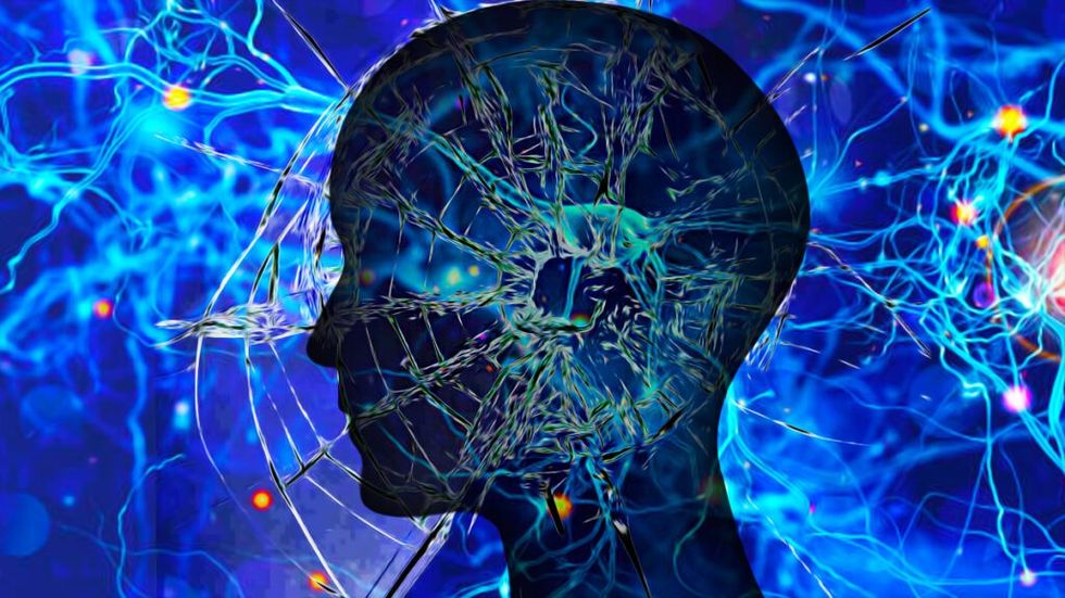 Profile view of head silhouette with colorful neuron network overlayed