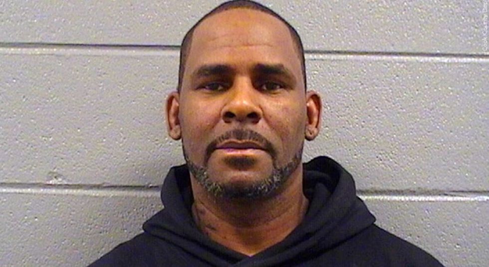 R. Kelly in black sweatshirt in his mugshot
