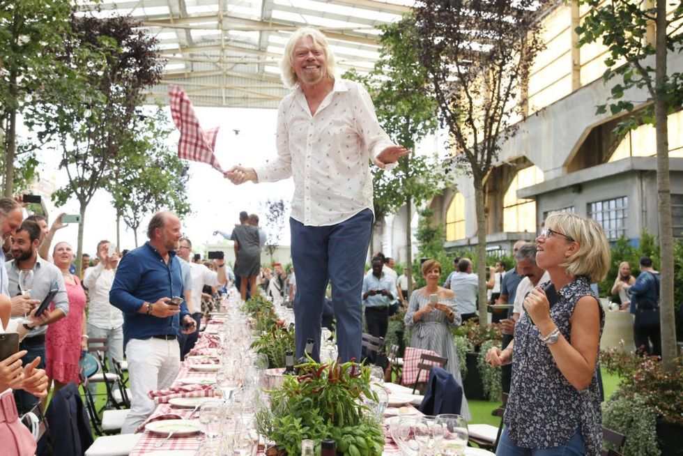 Richard-Branson-on-a-table