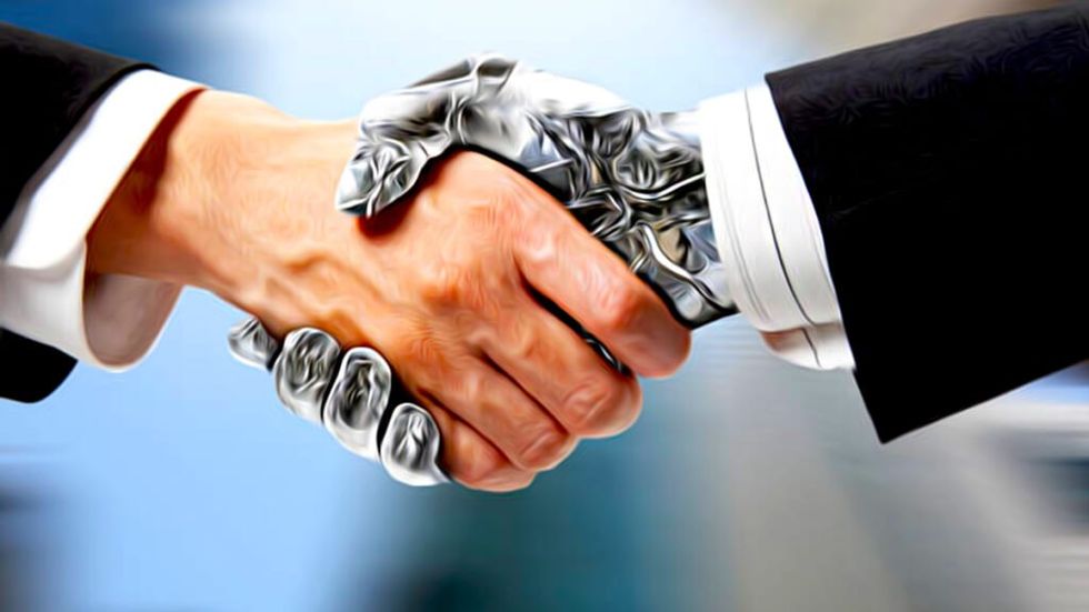 Robot shakes hands with human