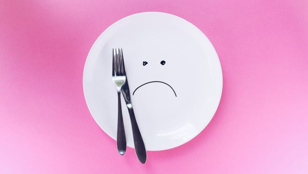sad dinner plate pink table