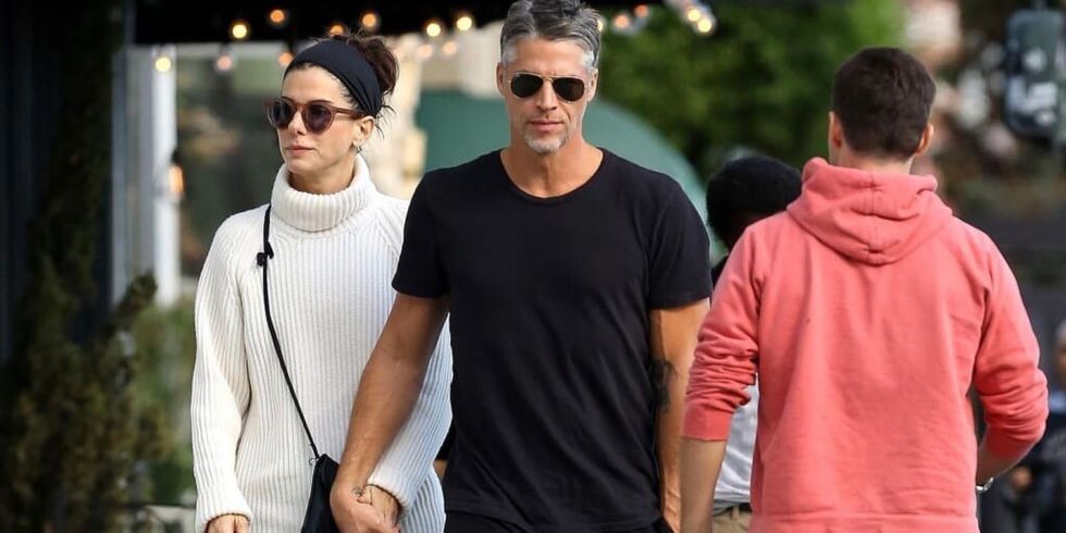Sandra Bullock and Bryan Randall walking together