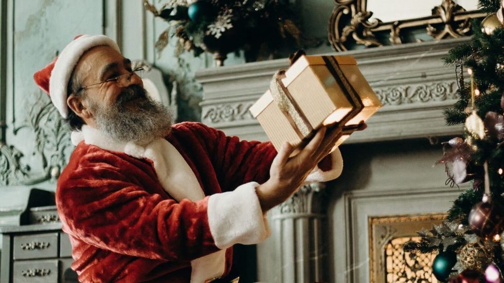 santa claus holding a gift