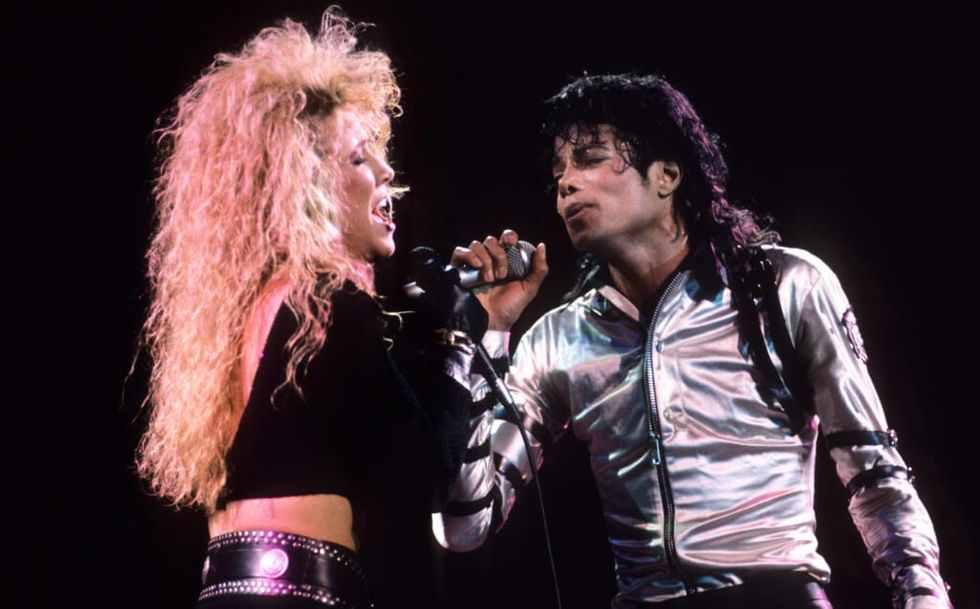 Sheryl Crow and Michael Jackson perform during the 