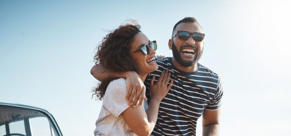 Shot of a young couple enjoying a summer\u2019s road trip together