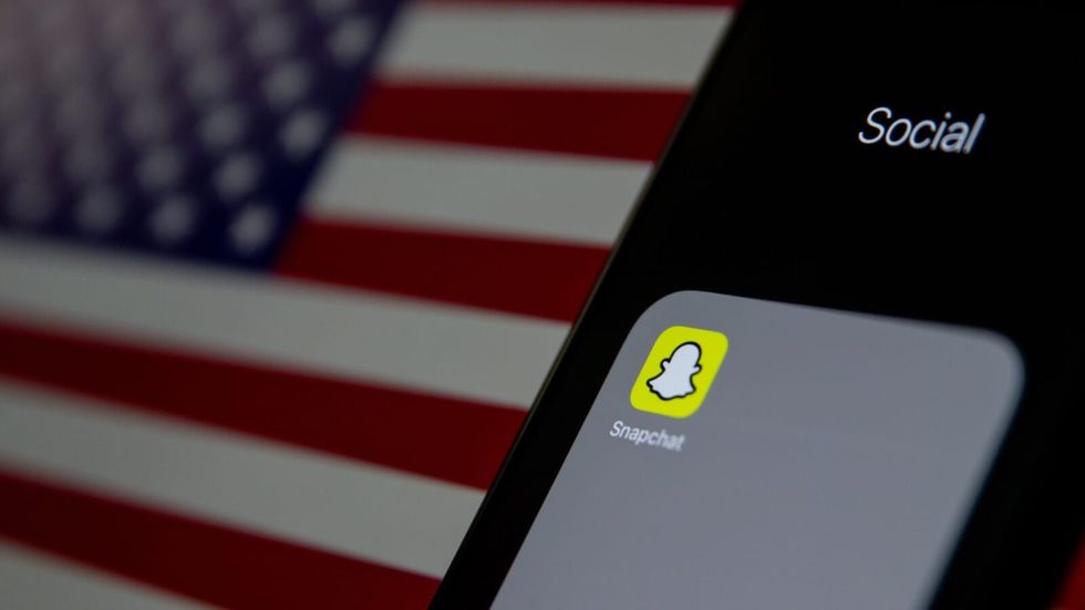 snapchat logo on a phone