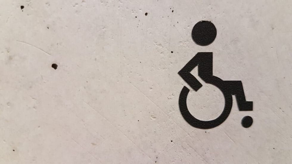 stencil of a person with a wheelchair